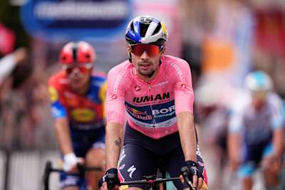 Primož Roglič is pictured wearing the pink jersey during the 2025 Giro d’Italia. 