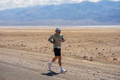 Arda Saatçi running under the blazing sun during the 2026 Red Bull Cyborg Season Ultra 600 in Death Valley, California.