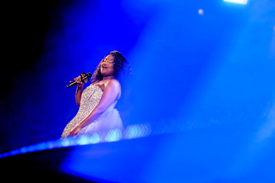 Simmy is captured mid-performance during Red Bull Symphonic in Johannesburg, South Africa on 14 June 2026, delivering a powerful set under vibrant stage lights