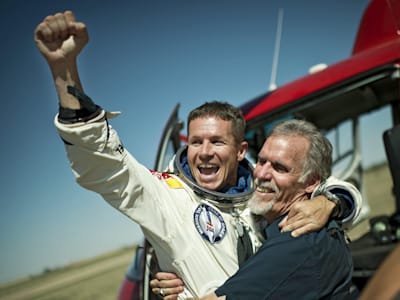 Felix Baumgartner and Art Thompson celebrate the successful completion of the Red Bull Stratos mission.