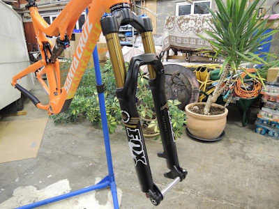 Mountain bike on stand with front and back wheels off