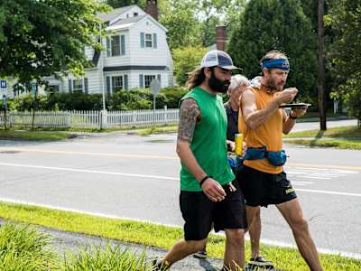 Karl Meltzer takes on some calories on the move, during his attempt to break the record for running the length of the Appalachian Trail on 13 August, 2016.