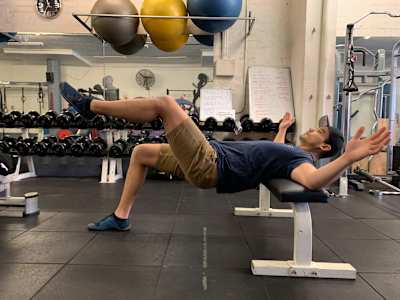 Ben performs a single-leg glute bridge.