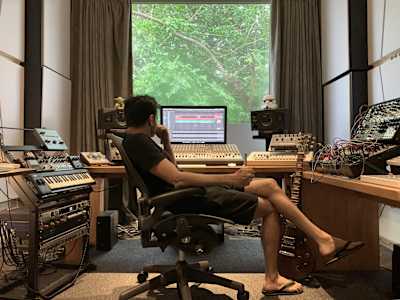 Arjun Vagale poses for a photo in his home studio.