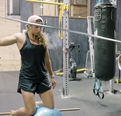 Kneel on the ball and practice a range of different pulls.