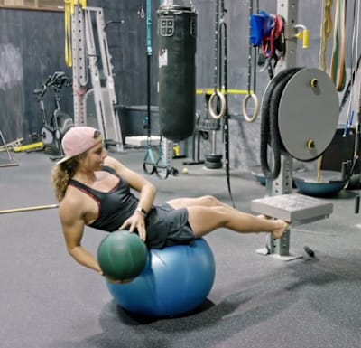 Practice sit ups, ball extensions, ball throws and Russian twists.