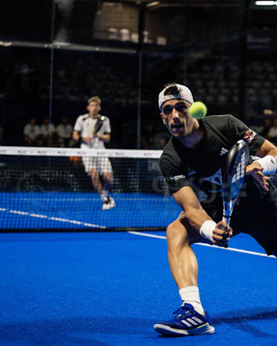 Alejandro Galan lunging towards a shot at the ball at the Premier Padel Acapulco P1, 2024