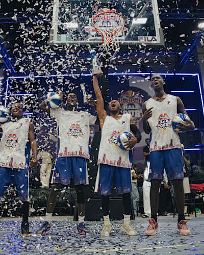 The Dream Team celebrates their triumph at the Red Bull Half Court 2025 final, throwing confetti on the court at Jewel Aida Event Center in Lagos, Nigeria, with basketballs held aloft