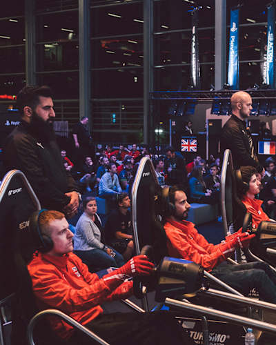 An image of gamers at the Gran Turismo Championship.