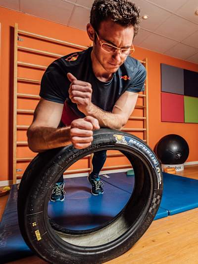 Thierry Neuville improves his core strength using a Michelin tyre.