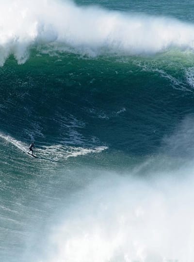 Surfer Sebastian Steudtner drops into a big wave at Nazare