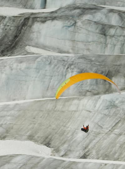 North of Known paragliders above the mountains