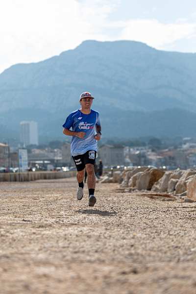 Vincent Matheron Wings For Life portrait in Marseille, France, on April 5, 2023, mountain in background.