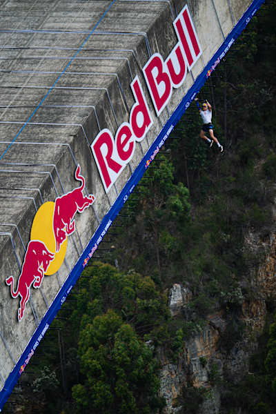 Thomas van Tonder is seen hanging from monkey bars during Red Bull Bridge Bars at Bloukrans Bridge in South Africa, in October 2026.