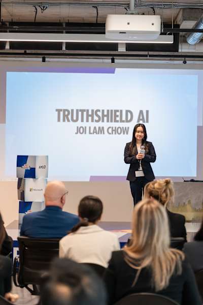 Joi Lam Chow pitches TruthShield AI on stage at Red Bull Canada HQ in Toronto during the Red Bull Basement Canada National Final on May 15, 2026.