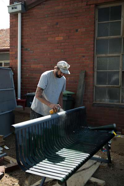 Jack Kirk paints the chair rail for Red Bull Spot Check Melbourne Naarm