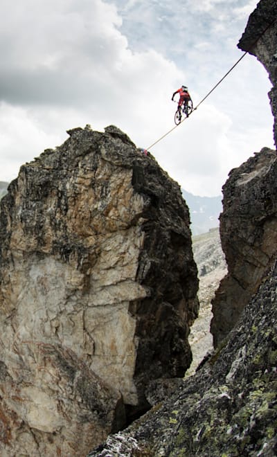 Kenny Belaey crosses the rock gap on a high line during his Balance project in La Plagne, France on July 13th, 2015