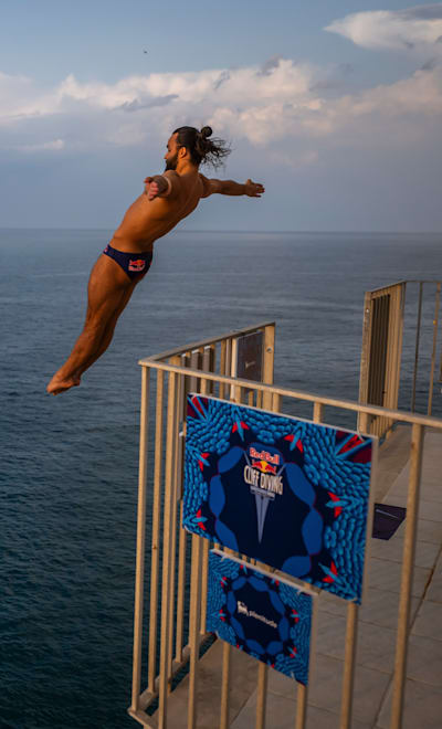 Catalin Preda of Romania dives from the 25.5 metre balcony during the first competition day of the third stop of the Red Bull Cliff Diving World Series in Polignano a Mare, Italy on July 1, 2023.
