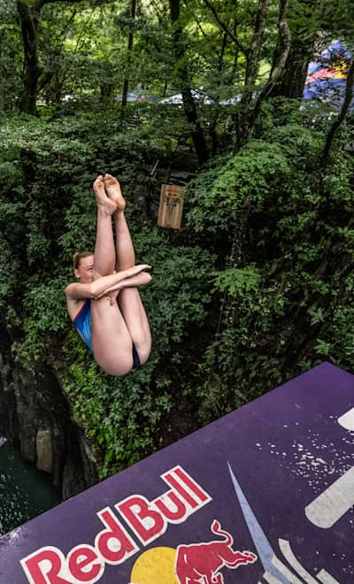 Molly Carlson of Canada dives from the 21 metre platform during the final competition day of the fourth stop of the Red Bull Cliff Diving World Series in Takachiho, Japan on August 3, 2023.
