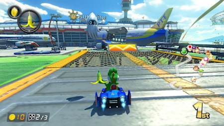 A screenshot of Yoshi with a banana in Mario Kart 8 Deluxe