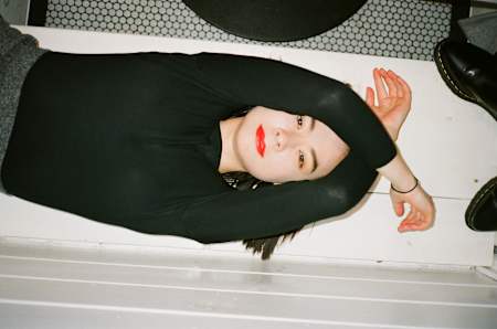 Mitski lounging at Lella Alimentari