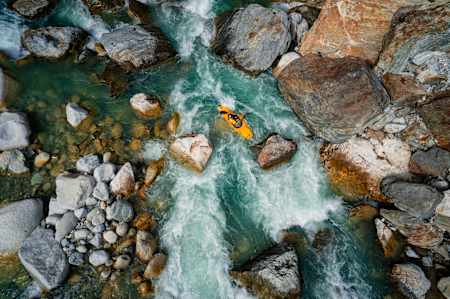 Kayaking down the the Reuss River in Switzerland in an aerial shot from a drone camera.