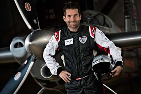 Austrian pilot Hannes Arch poses for a photograph