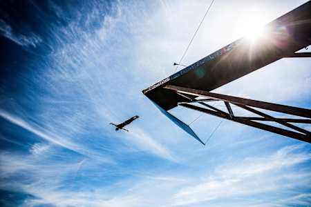A cliff diver in mid-air during the Red Bull Cliff Diving World Series 2014 in Kragerø, Norway on July 12