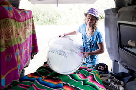 Marie-France Roy loads up for a day of surfing.