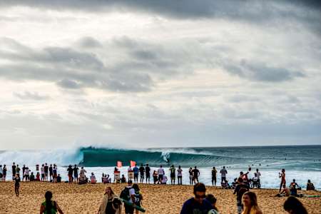 Australian surfer Julian Wilson drops in to the takeoff at Pipeline break on Hawaii's North shore