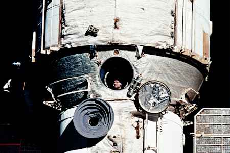 Valery Polyakov looks out the window of the Russian space station during his flight