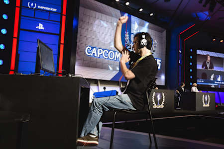 Keoma pumps his fist in celebration at Capcom Cup