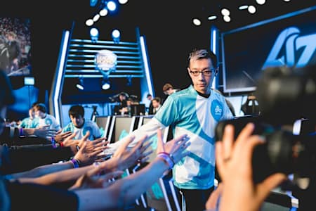 Hai fives fans after a win