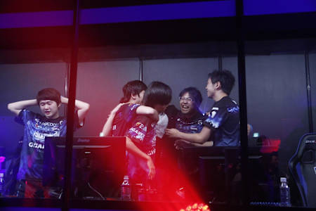 Umezaki celebrating with his team after a win