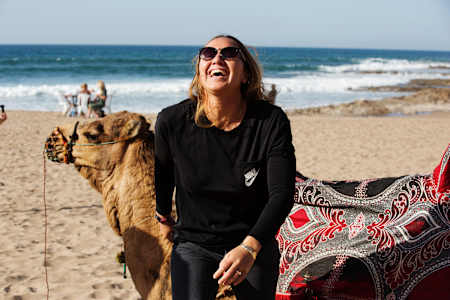 Carissa Moore poses with a camel in Morocco