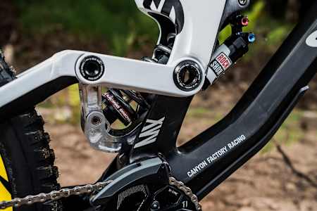 Close up of the custom linkage on Mark Wallace's Canyon Sender DH MTB in Fort William, Scotland