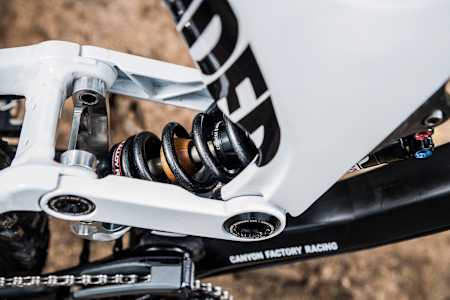 Close up view of the custom suspension linkage on Mark Wallace's Canyon Sender DH MTB
