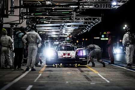 The Porsche team make a pit stop during the night at the Le Mans 24 Hours endurance race in Le Mans, France on June 17, 2017.