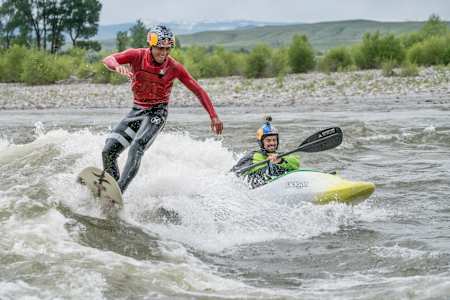 The two Red Bull athletes ride together in the Yellowstone River.