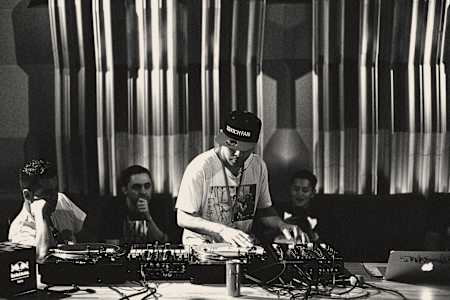 Pioneering turntablist DJ Qbert drops the beat during a Red Bull 3Style workshop at the 2015 World Final in Tokyo, Japan.
