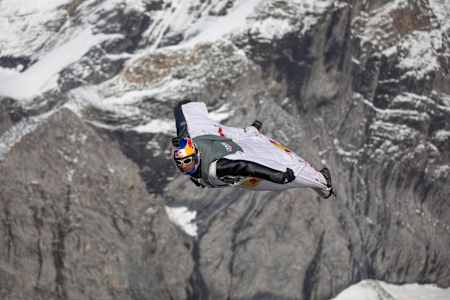 Fred Fugen flying above Swiss Mountains.