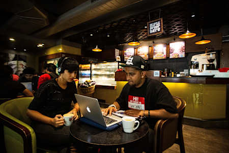 Rapper Gubbi and singer Madhura Gowda discuss music in a Cafe Coffee Day outlet in Jayanagar, Bengaluru