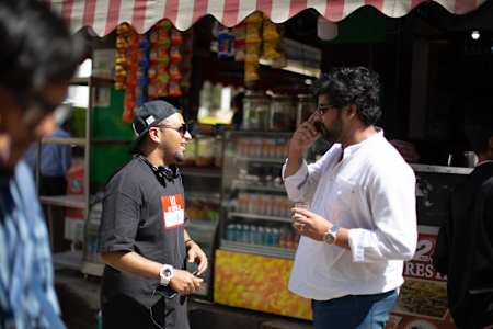 Rapper Gubbi and beat producer The Sound of Sa talk near a tea stall in SG Palya in Bengaluru