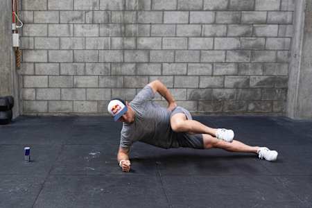 Brook Macdonald does a side plank variation for Red Bull Fit 2019.