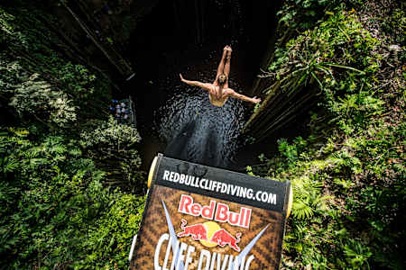 Adriana Jimenez of Mexico dives from the 20m platform during the  final stop of the Red Bull Cliff Diving World Series, Ik Kil cenote, Yucatan, Mexico, on October 17, 2014.