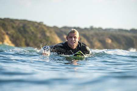 Mick Fanning paddles out at Bells.