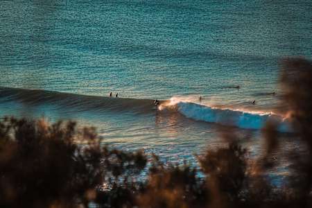 Surfers at Bells Beach enjoy a morning session.