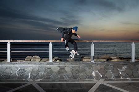 Jason Choi performs a Tre Flip