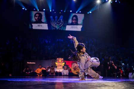 In 2022, B-Girl India performs an acrobatic move at Red Bull BC One World Final.