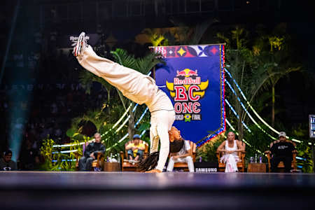 In 2024, B-Girl India performs an acrobatic move at the Red Bull BC One World Final event in Rio de Janeiro, Brazil